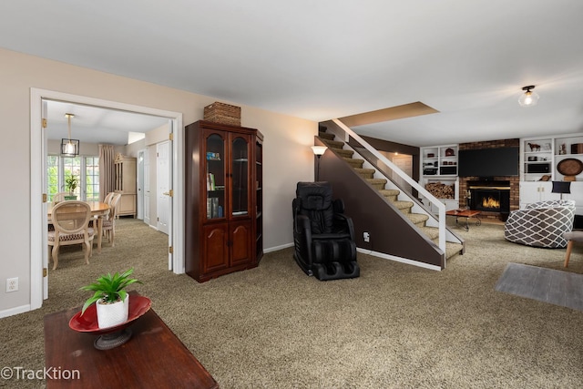 2609 Dougall Rd, Joliet, IL 60433 - living area featuring a fireplace, stairs, carpet flooring, and built in shelves