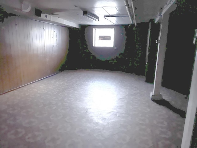 1511 N Linder Ave, Chicago, IL 60651 - below grade area with tile patterned floors and wood walls