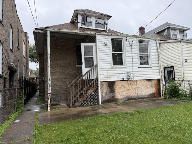 1511 N Linder Ave, Chicago, IL 60651 - back of house featuring brick siding and roof with shingles