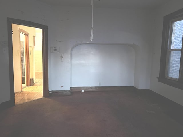 1511 N Linder Ave, Chicago, IL 60651 - spare room featuring arched walkways and carpet flooring