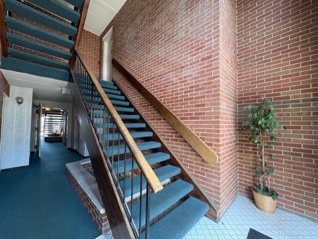 10811 S Keating Ave Unit 3Se, Oak Lawn, IL 60453 - stairs with brick wall and a towering ceiling