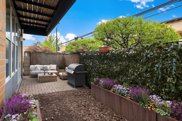 2257 W Lake St Unit 101, Chicago, IL 60612 - fenced backyard with a patio area, outdoor lounge area, and area for grilling