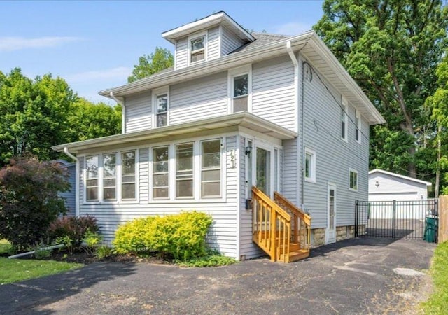 721 S Batavia Ave, Batavia, IL 60510 - traditional style home featuring entry steps, an outdoor structure, and a detached garage