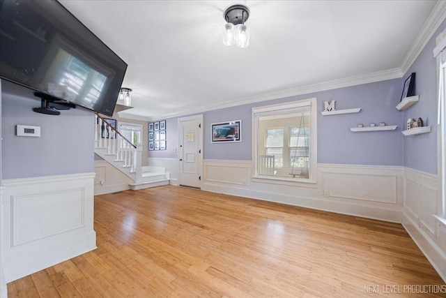 721 S Batavia Ave, Batavia, IL 60510 - entryway with stairs, light wood finished floors, crown molding, wainscoting, and a decorative wall