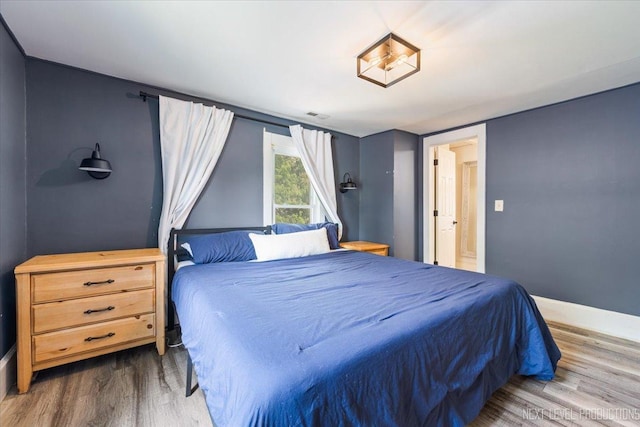 721 S Batavia Ave, Batavia, IL 60510 - bedroom with wood finished floors and baseboards