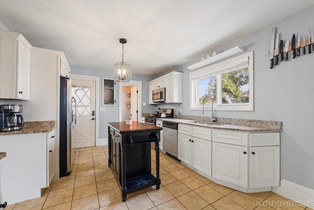 721 S Batavia Ave, Batavia, IL 60510 - kitchen featuring stainless steel appliances, white cabinets, and healthy amount of natural light