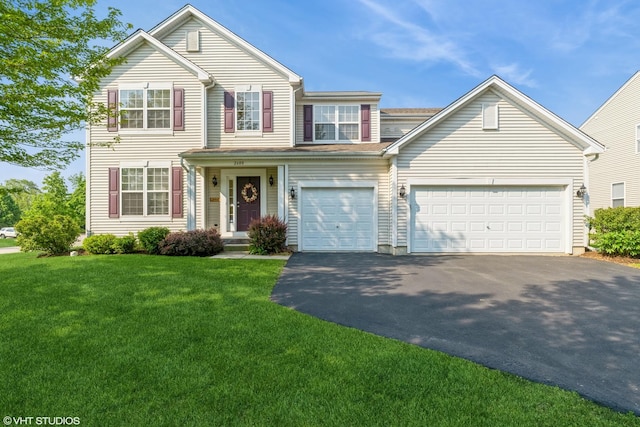 2600 W Autumn Dr, Round Lake, IL 60073 - traditional-style house featuring driveway, a front lawn, and a garage