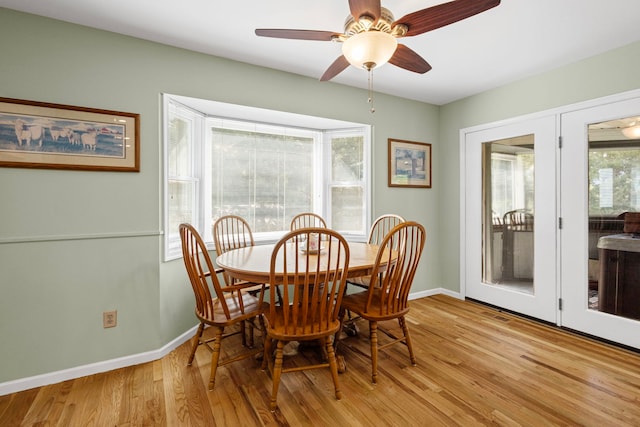 6897 Galena Rd, Bristol, IL 60512 - dining area featuring baseboards, light wood finished floors, and ceiling fan