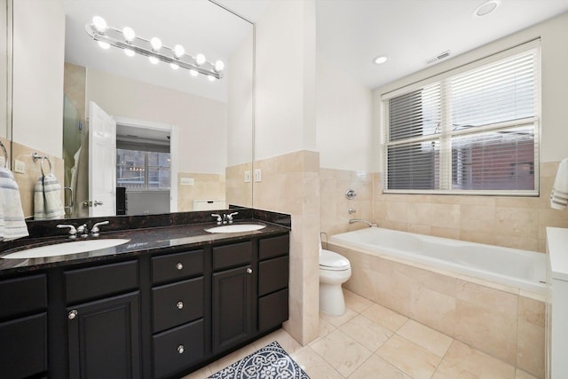 851 W Fletcher St Unit 2, Chicago, IL 60657 - full bathroom with a bath, double vanity, tile patterned floors, and toilet