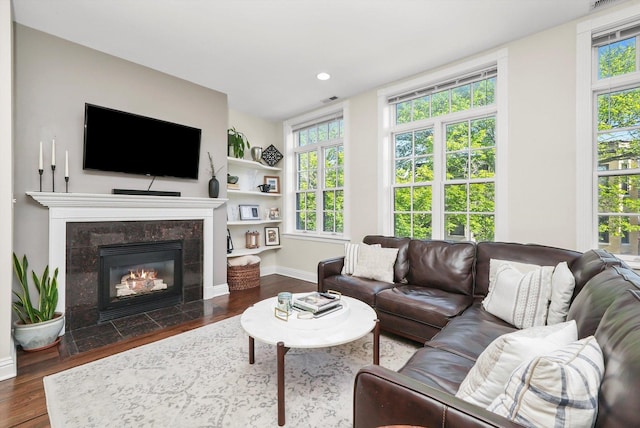 851 W Fletcher St Unit 2, Chicago, IL 60657 - living room featuring dark wood finished floors, baseboards, a fireplace, and recessed lighting