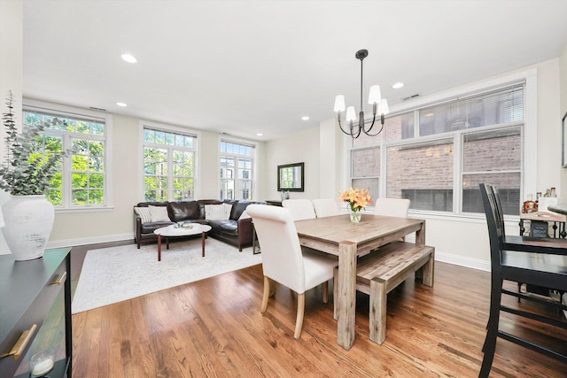 851 W Fletcher St Unit 2, Chicago, IL 60657 - dining space with a chandelier, wood finished floors, baseboards, and recessed lighting