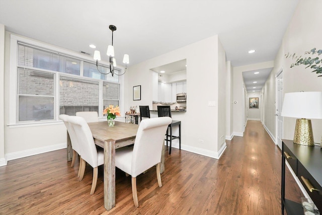 851 W Fletcher St Unit 2, Chicago, IL 60657 - dining space featuring a chandelier, wood finished floors, baseboards, and recessed lighting