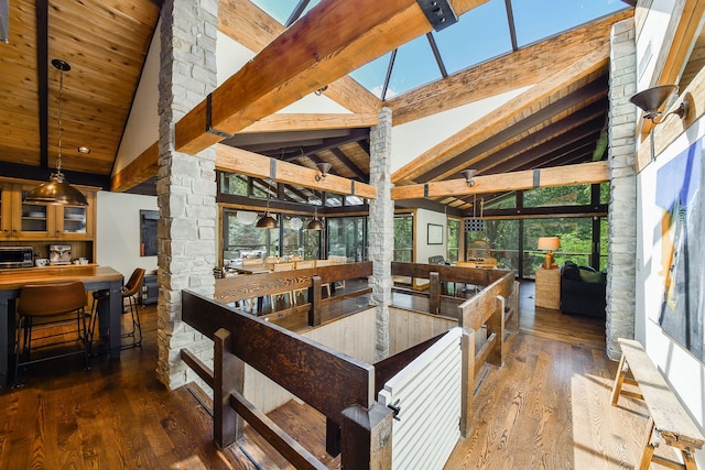 4N650 Pheasant Run Dr, Saint Charles, IL 60175 - kitchen featuring hardwood / wood-style flooring, high vaulted ceiling, stainless steel microwave, a wooden ceiling with exposed beams, and pendant lighting
