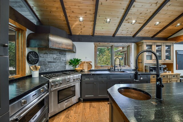 4N650 Pheasant Run Dr, Saint Charles, IL 60175 - kitchen with high end stainless steel range, extractor fan, wood ceiling, light wood-type flooring, and dark stone countertops