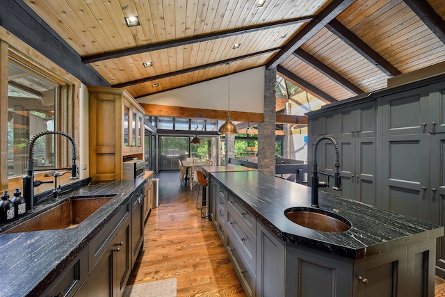 4N650 Pheasant Run Dr, Saint Charles, IL 60175 - kitchen with a wood ceiling with exposed beams, light wood-style flooring, healthy amount of natural light, dark stone counters, and high vaulted ceiling
