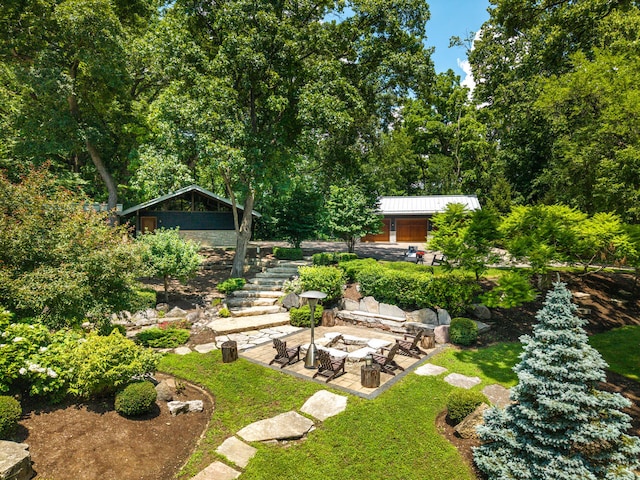 4N650 Pheasant Run Dr, Saint Charles, IL 60175 - view of yard with a fire pit, stairs, a patio, and an outdoor structure