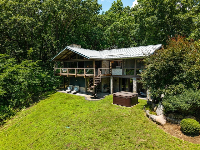 4N650 Pheasant Run Dr, Saint Charles, IL 60175 - back of property featuring a hot tub, a patio, a deck, stone siding, and a yard