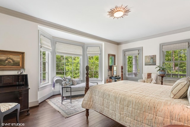 bedroom featuring ornamental molding, dark wood-style flooring, and baseboards