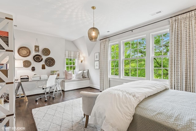 bedroom featuring multiple windows, baseboards, dark wood-style floors, and vaulted ceiling