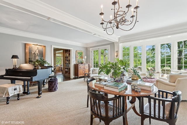dining space featuring crown molding, a chandelier, and carpet flooring
