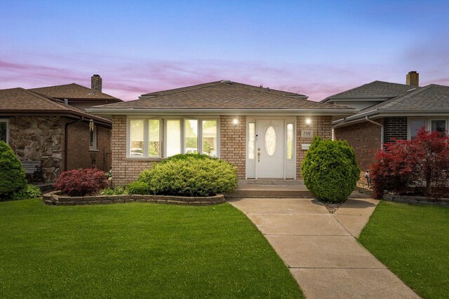 7510 Lorel Ave, Burbank, IL 60459 - view of front of house with a lawn and brick siding