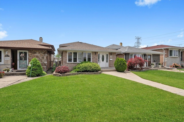 7510 Lorel Ave, Burbank, IL 60459 - view of front of home with a chimney, a front yard, and brick siding