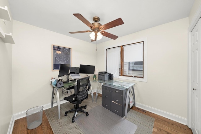 7510 Lorel Ave, Burbank, IL 60459 - home office with a ceiling fan and wood finished floors