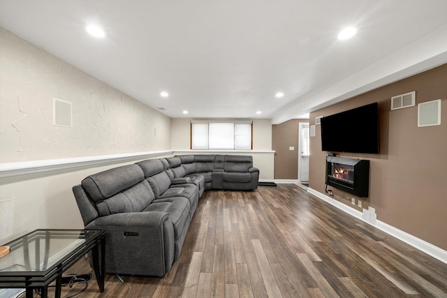 7510 Lorel Ave, Burbank, IL 60459 - living area featuring dark wood-style floors, a glass covered fireplace, and recessed lighting