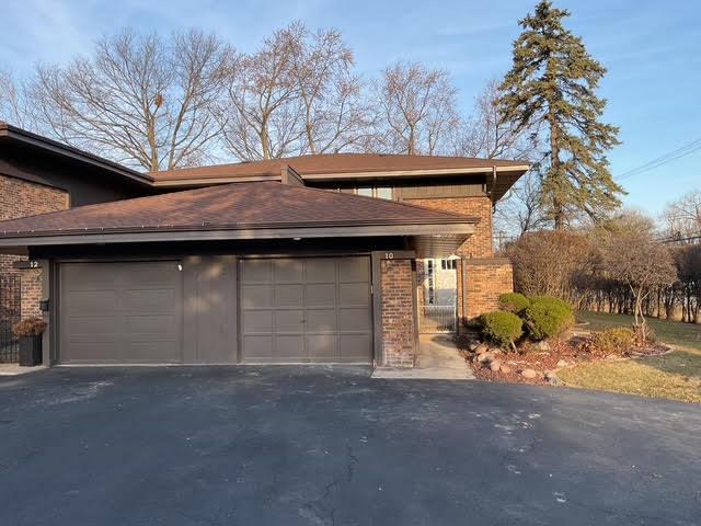 10 Cedar Creek Ct Unit A-10, Palos Heights, IL 60463 - view of side of property with brick siding, asphalt driveway, and a garage