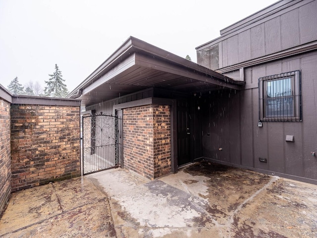 10 Cedar Creek Ct Unit A-10, Palos Heights, IL 60463 - view of exterior entry featuring a gate and brick siding