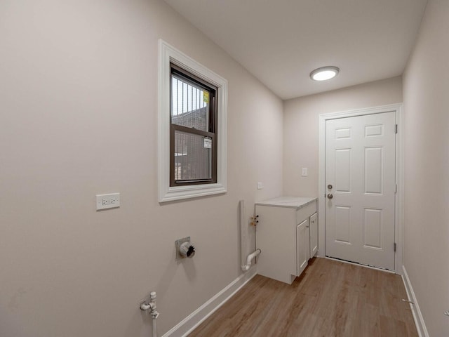10 Cedar Creek Ct Unit A-10, Palos Heights, IL 60463 - washroom featuring light wood finished floors, baseboards, and cabinet space