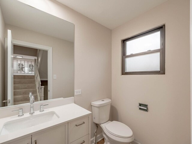 10 Cedar Creek Ct Unit A-10, Palos Heights, IL 60463 - bathroom featuring baseboards, toilet, and vanity