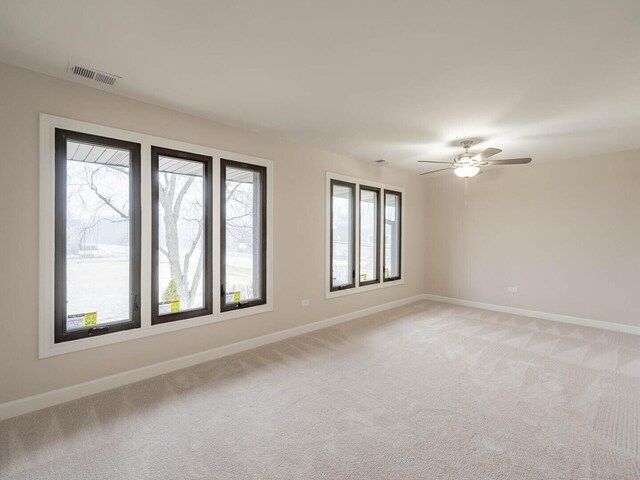 10 Cedar Creek Ct Unit A-10, Palos Heights, IL 60463 - spare room with light carpet, baseboards, and ceiling fan