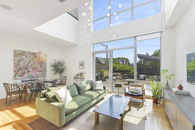 1615 N Wolcott Ave Unit 204, Chicago, IL 60622 - living area featuring light wood-style floors and a high ceiling