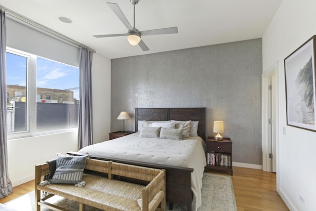 1615 N Wolcott Ave Unit 204, Chicago, IL 60622 - bedroom featuring light wood finished floors, a ceiling fan, and baseboards