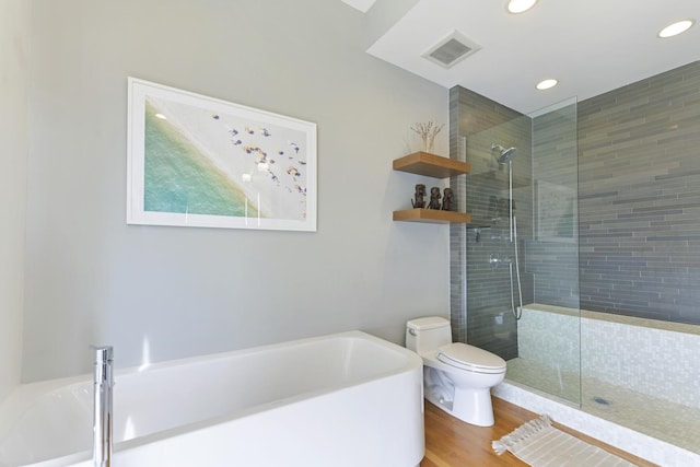 1615 N Wolcott Ave Unit 204, Chicago, IL 60622 - bathroom featuring toilet, a garden tub, tiled shower, recessed lighting, and wood finished floors