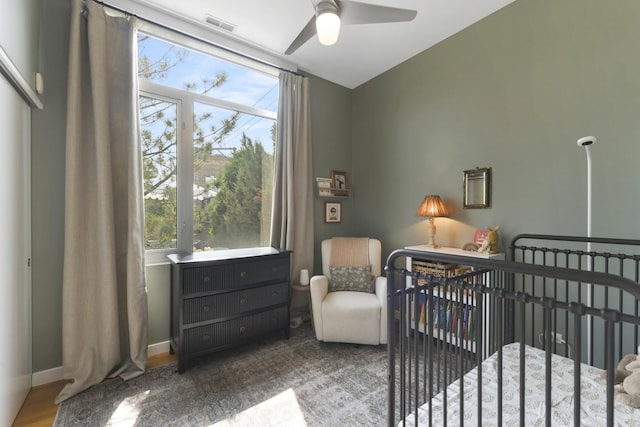 1615 N Wolcott Ave Unit 204, Chicago, IL 60622 - bedroom with a nursery area, a ceiling fan, and baseboards