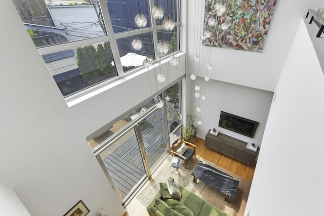 1615 N Wolcott Ave Unit 204, Chicago, IL 60622 - living area with a towering ceiling and wood finished floors