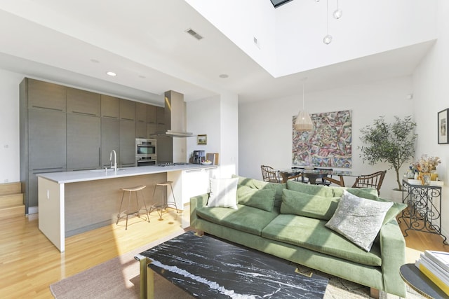1615 N Wolcott Ave Unit 204, Chicago, IL 60622 - living room featuring light wood finished floors, a skylight, and recessed lighting