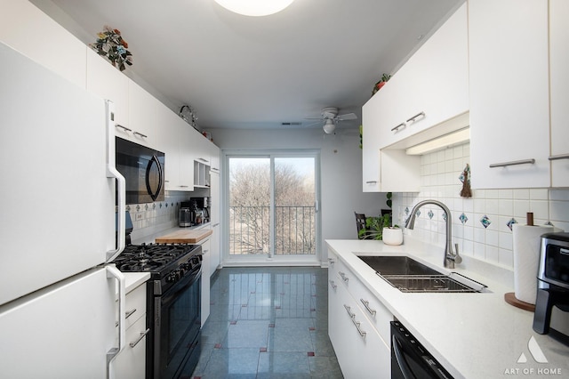 805 Leicester Rd Unit 320, Elk Grove Village, IL 60007 - kitchen with black appliances, a sink, decorative backsplash, light countertops, and white cabinetry