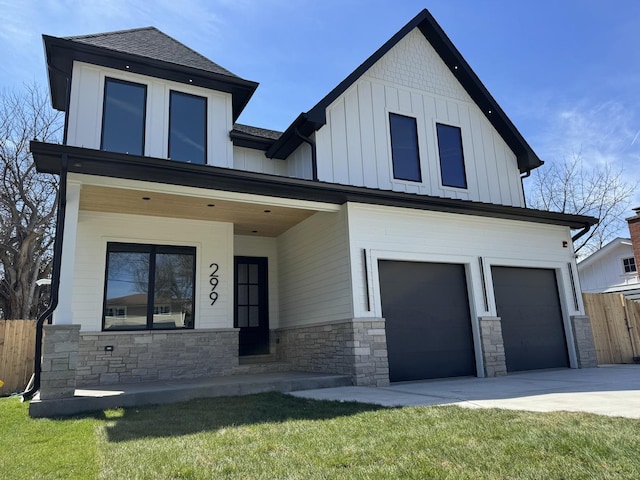 299 Cottage Ave, Glen Ellyn, IL 60137 - view of front of house with a garage, stone siding, board and batten siding, and concrete driveway
