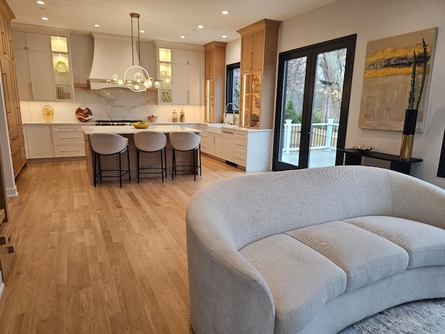 299 Cottage Ave, Glen Ellyn, IL 60137 - living area with light wood-type flooring, recessed lighting, a chandelier, and french doors