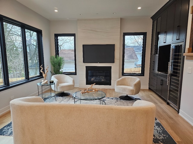 299 Cottage Ave, Glen Ellyn, IL 60137 - living room with a fireplace, light wood-style floors, baseboards, and recessed lighting