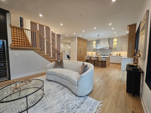 299 Cottage Ave, Glen Ellyn, IL 60137 - living area with light wood-style floors, stairs, recessed lighting, wine cooler, and baseboards
