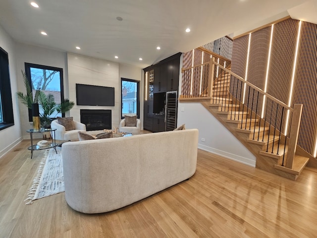 299 Cottage Ave, Glen Ellyn, IL 60137 - living room with light wood-style flooring, stairway, baseboards, a large fireplace, and recessed lighting