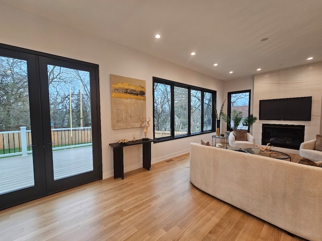 299 Cottage Ave, Glen Ellyn, IL 60137 - living room with light wood-style floors, a fireplace, baseboards, recessed lighting, and french doors