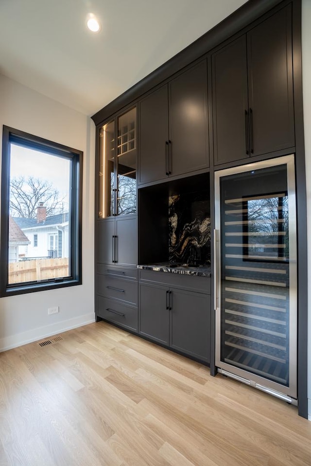 299 Cottage Ave, Glen Ellyn, IL 60137 - bar area featuring beverage cooler, light wood-type flooring, baseboards, and recessed lighting