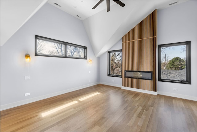 299 Cottage Ave, Glen Ellyn, IL 60137 - unfurnished living room with high vaulted ceiling, ceiling fan, wood finished floors, and baseboards