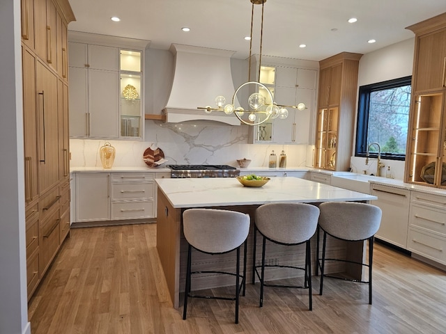 299 Cottage Ave, Glen Ellyn, IL 60137 - kitchen featuring white dishwasher, premium range hood, a sink, tasteful backsplash, and recessed lighting