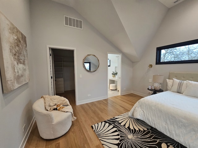 299 Cottage Ave, Glen Ellyn, IL 60137 - bedroom featuring baseboards, light wood-style floors, lofted ceiling, a spacious closet, and ensuite bathroom
